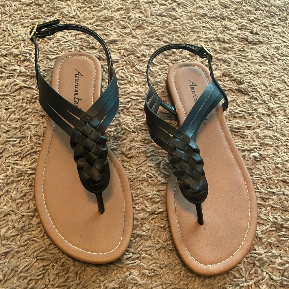 Black strappy sandals.